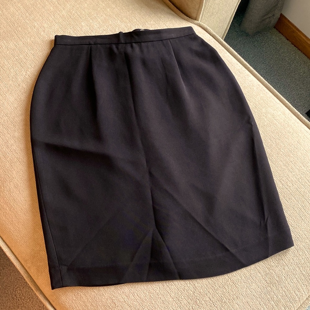 Black size 6 annex skirt. Fully lined. Button and zipper back. Slight slit.
